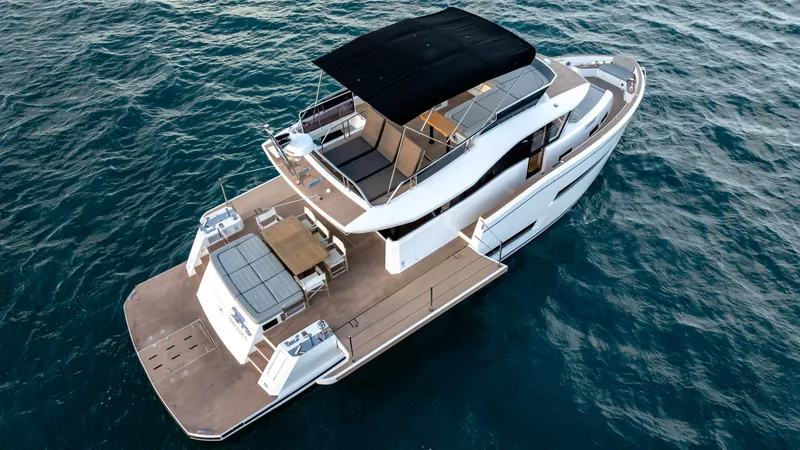 Slide: The Image of 2024 Pardo Yachts E60 luxury yacht on open water, aerial view. - 13