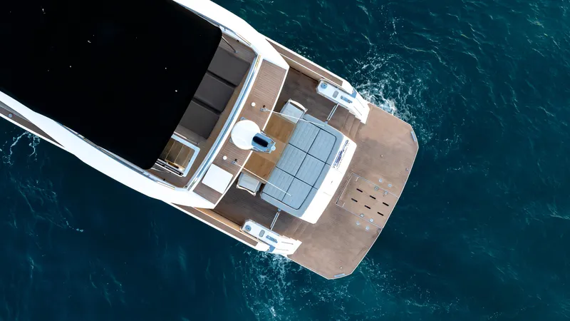 Slide: The Image of Top view of 2024 Pardo Yachts E60 on blue ocean water. - 14