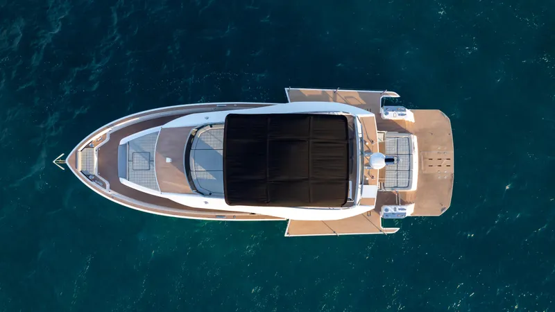 Slide: The Image of Top view of 2024 Pardo Yachts E60 on blue ocean water. - 16