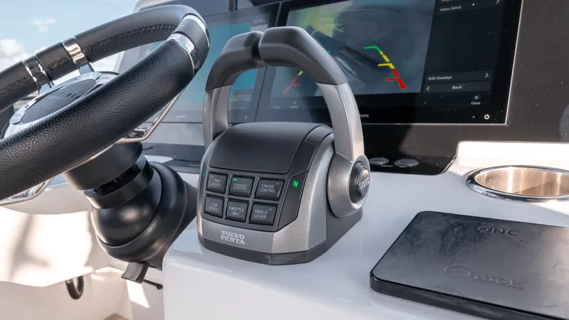 Slide: The Image of Control panel of 2024 Pardo Yachts E60 with steering wheel and digital display. - 21