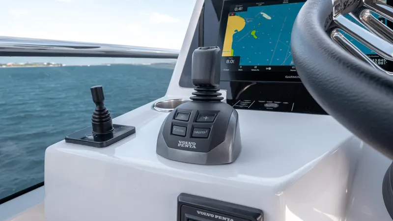 Slide: The Image of 2024 Pardo Yachts E60 helm with joystick controls and navigation display. - 22