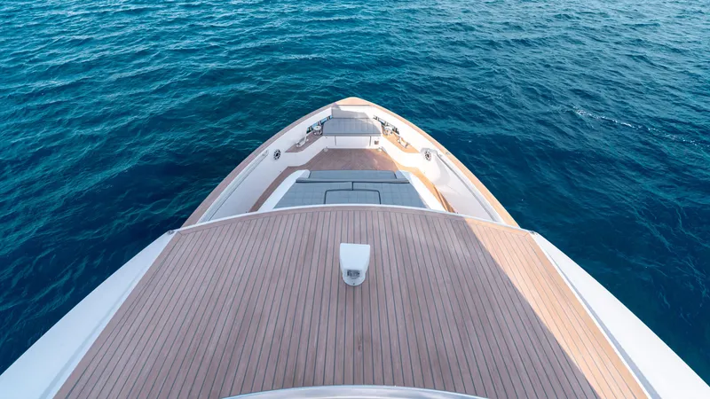Slide: The Image of 2024 Pardo Yachts E60 bow view on open sea, showcasing sleek deck design. - 24