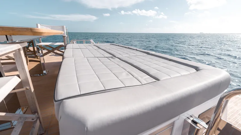 Slide: The Image of 2024 Pardo Yachts E60 luxury deck with sunbed overlooking the ocean. - 45