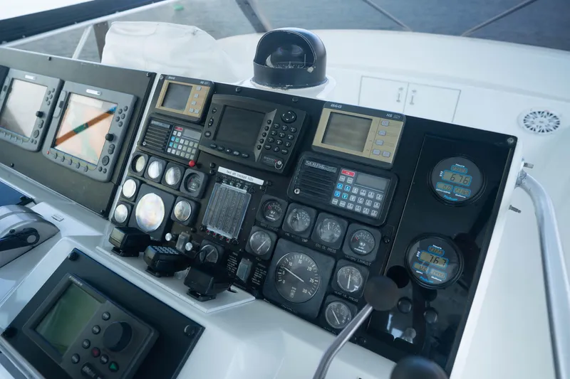 Slide: The Image of Control panel of a 1990 Hatteras 58 Convertible yacht with navigation instruments. - 14