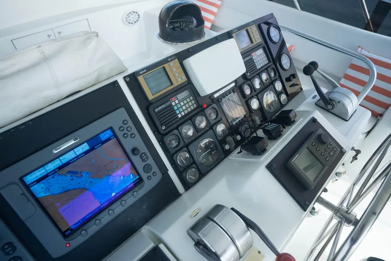 Slide: The Image of Control panel of a 1990 Hatteras 58 Convertible yacht with navigation equipment. - 15
