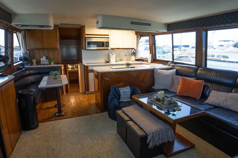 Slide: The Image of Luxurious interior of a 1990 Hatteras 58 Convertible yacht with modern amenities. - 17