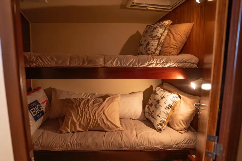Slide: The Image of Bunk beds in a cozy cabin of a 1990 Hatteras 58 Convertible yacht. - 33