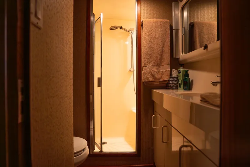 Slide: The Image of Bathroom interior of 1990 Hatteras 58 Convertible yacht, featuring shower and vanity. - 40