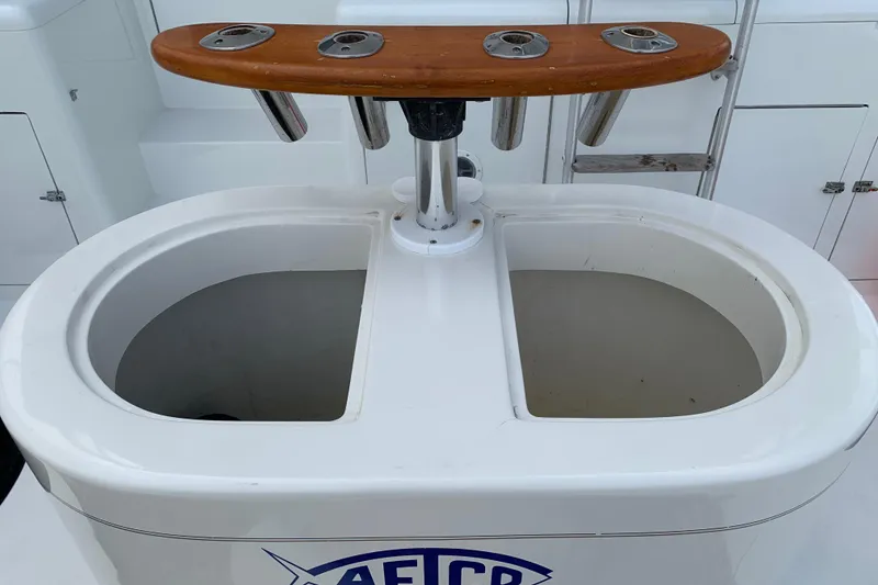 Slide: The Image of Fishing station on a 1990 Hatteras 58 Convertible yacht with rod holders and bait wells. - 42