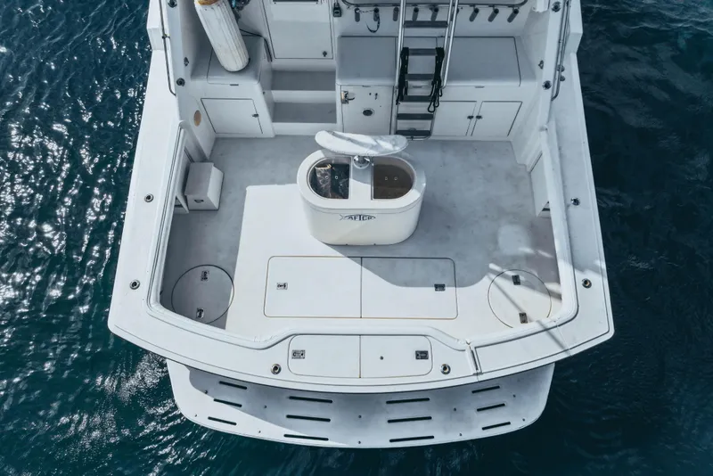 Slide: The Image of Aerial view of 1990 Hatteras 58 Convertible yacht deck on the water. - 9