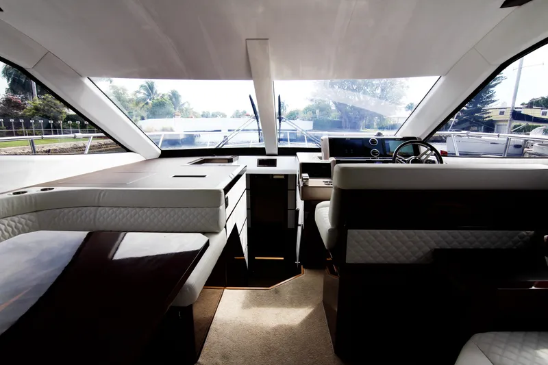 Slide: The Image of Interior of 2020 Galeon 550 Fly yacht, featuring luxurious seating and modern design. - 10