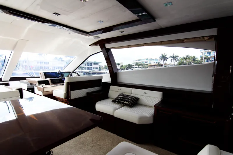 Slide: The Image of Luxurious interior of 2020 Galeon 550 Fly yacht with elegant seating and panoramic windows. - 13
