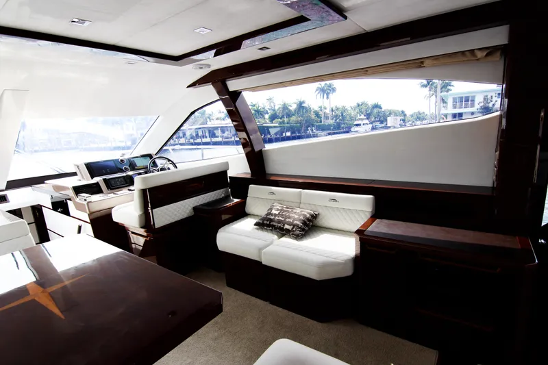 Slide: The Image of Luxurious interior of 2020 Galeon 550 Fly yacht with elegant seating and large windows. - 14