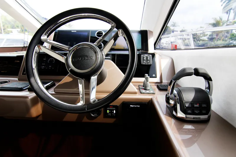 Slide: The Image of Helm of 2020 Galeon 550 Fly yacht, featuring modern steering and controls. - 17