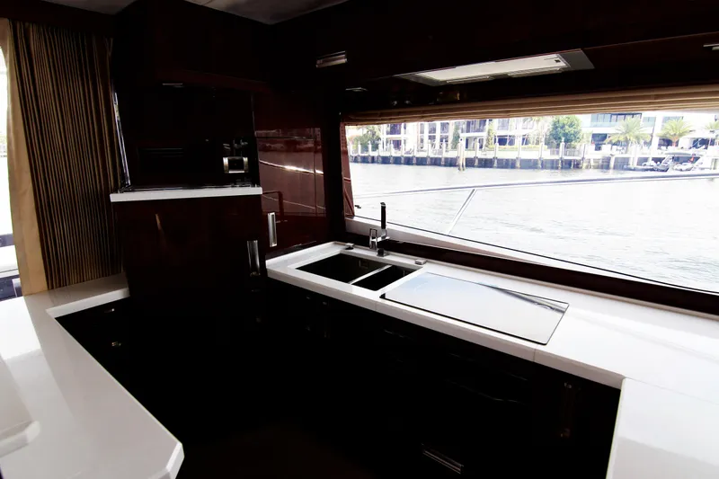 Slide: The Image of Modern kitchen interior of 2020 Galeon 550 Fly yacht with waterfront view. - 23