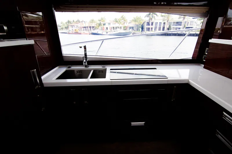 Slide: The Image of Modern kitchen interior on 2020 Galeon 550 Fly yacht with waterfront view. - 24