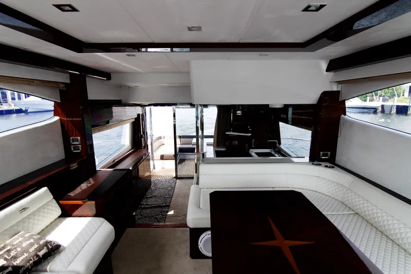 Slide: The Image of Luxurious interior of 2020 Galeon 550 Fly yacht with elegant seating and waterfront view. - 25