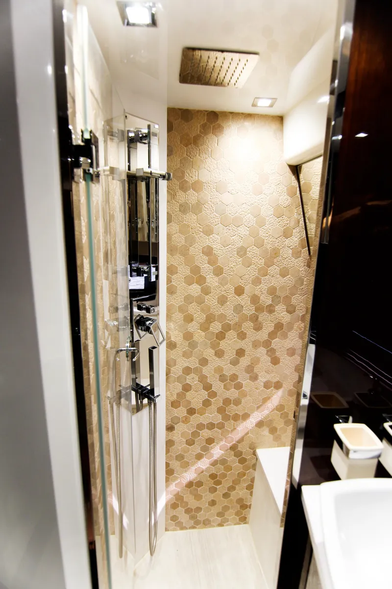 Slide: The Image of Luxurious bathroom in 2020 Galeon 550 Fly yacht with modern shower and elegant tile design. - 36