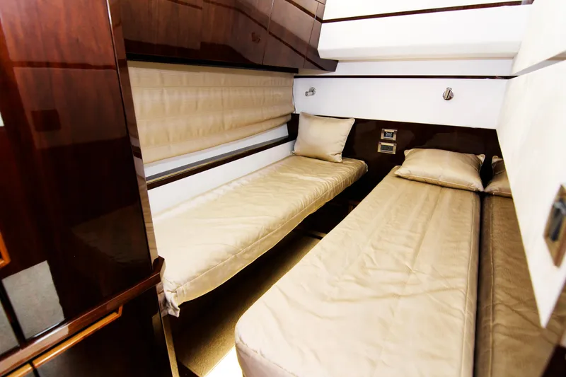Slide: The Image of Luxurious cabin interior of 2020 Galeon 550 Fly yacht with twin beds. - 37