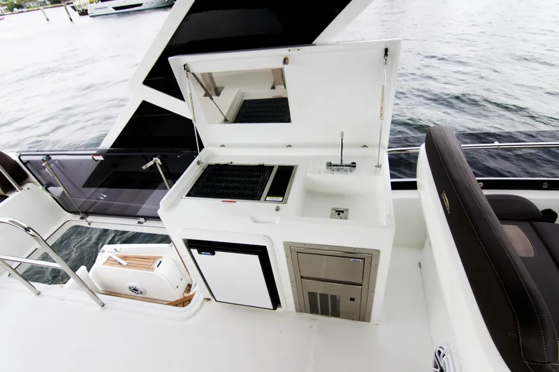 Slide: The Image of Outdoor kitchen on 2020 Galeon 550 Fly yacht with grill, sink, and storage. - 42