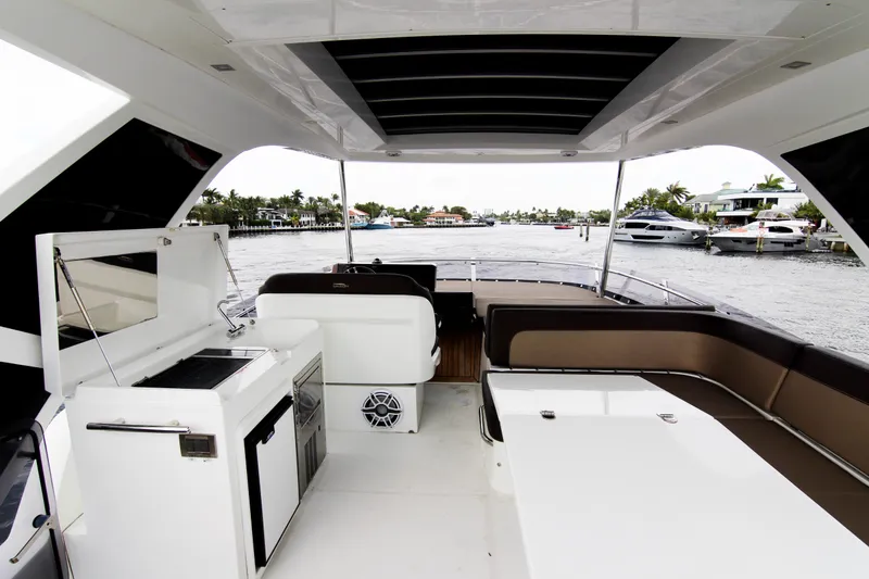 Slide: The Image of Luxurious 2020 Galeon 550 Fly yacht interior with seating and water view. - 44
