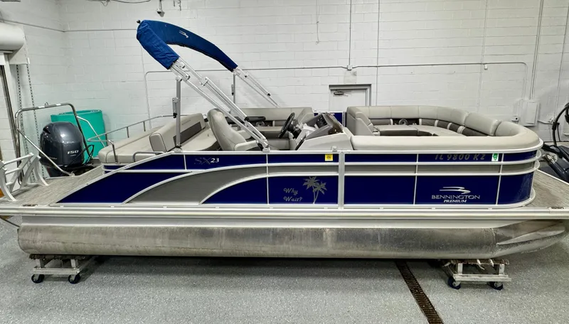 Slide: The Image of 2020 Bennington SXP 23 SSBXP pontoon boat in a garage setting. - 0