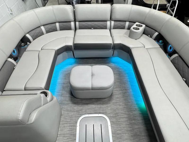 Slide: The Image of 2020 Bennington SXP 23 SSBXP pontoon boat interior with gray seating and blue LED lighting. - 11