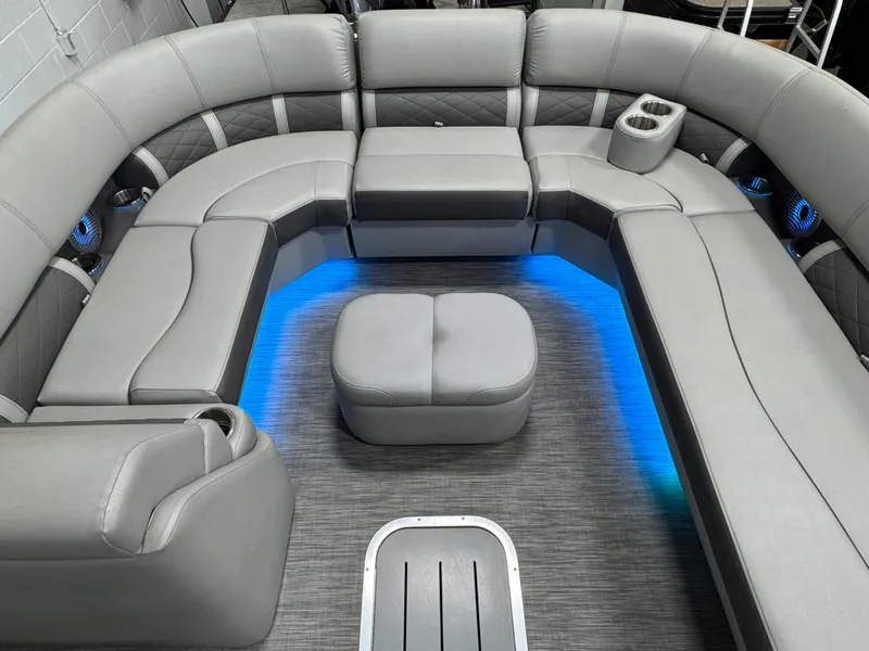Slide: The Image of 2020 Bennington SXP 23 SSBXP pontoon boat interior with gray seating and blue LED lighting. - 12