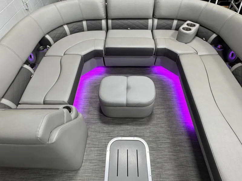 Slide: The Image of Luxurious seating on 2020 Bennington SXP 23 SSBXP pontoon with ambient purple lighting. - 14