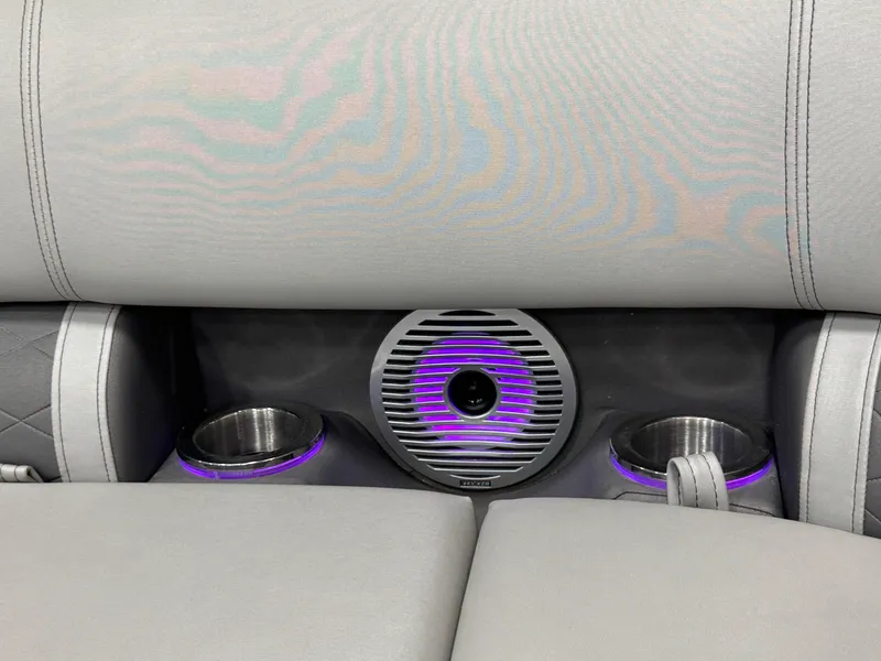 Slide: The Image of 2020 Bennington SXP 23 SSBXP boat interior with illuminated cup holders and speaker. - 15