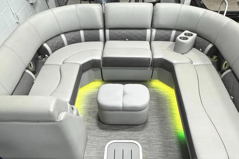 Slide: The Image of 2020 Bennington SXP 23 SSBXP boat interior with gray seating and ambient lighting. - 16