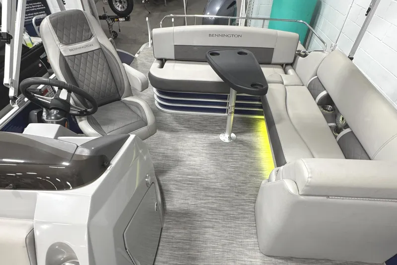 Slide: The Image of 2020 Bennington SXP 23 SSBXP boat interior with seating and table. - 18