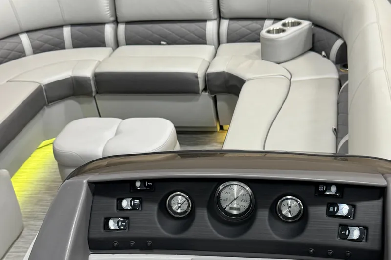 Slide: The Image of 2020 Bennington SXP 23 SSBXP boat interior with plush seating and control panel. - 20