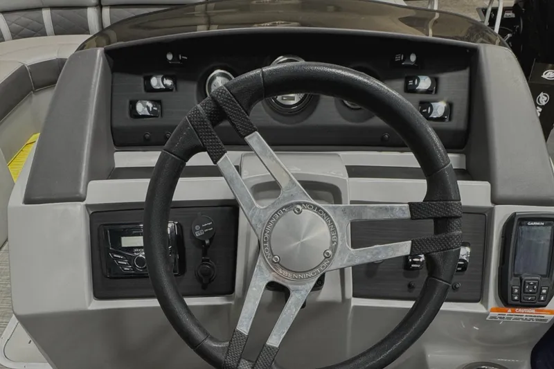 Slide: The Image of Steering console of 2020 Bennington SXP 23 SSBXP boat with modern controls and gauges. - 21