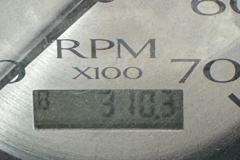 Slide: The Image of Close-up of RPM gauge reading 3100 on 2020 Bennington SXP 23 SSBXP. - 24