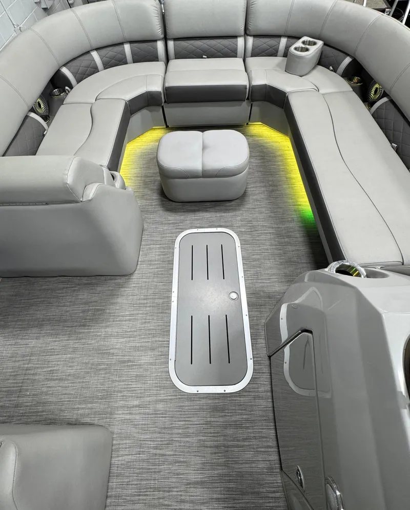 Slide: The Image of 2020 Bennington SXP 23 SSBXP pontoon boat interior with gray seating and ambient lighting. - 5