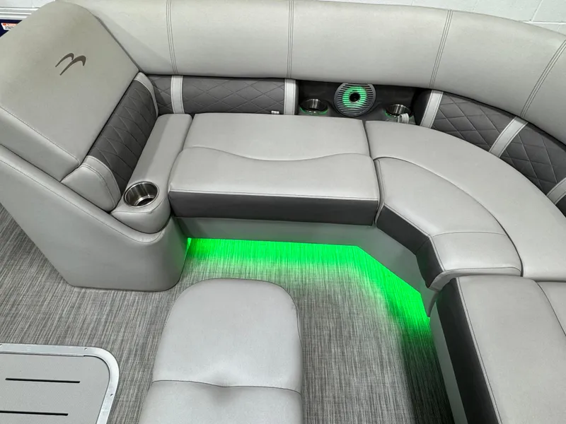 Slide: The Image of Luxurious seating in 2020 Bennington SXP 23 SSBXP pontoon with ambient green lighting. - 8