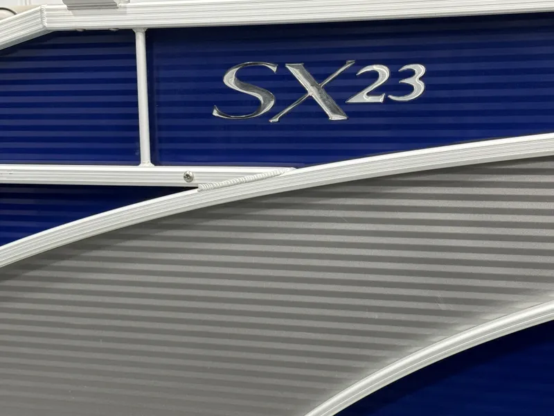 Slide: The Image of 2020 Bennington SXP 23 SSBXP boat with blue and silver detailing. - 9