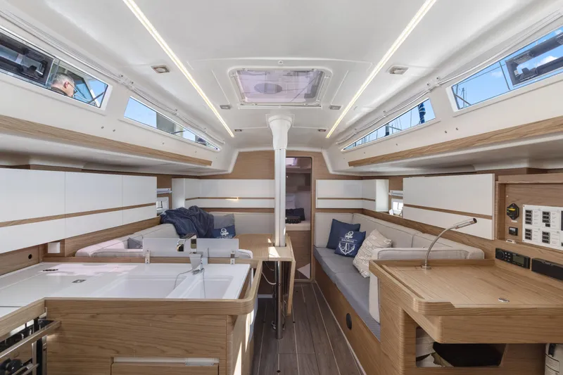 Slide: The Image of Modern interior of 2017 Elan E4 sailboat with sleek wood finishes and ample natural light. - 12
