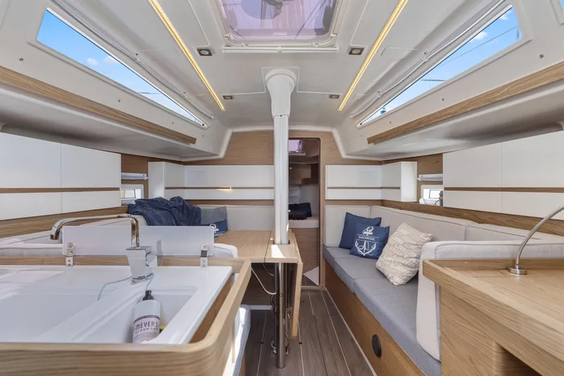 Slide: The Image of Luxurious interior of a 2017 Elan E4 yacht with modern design and comfortable seating. - 20