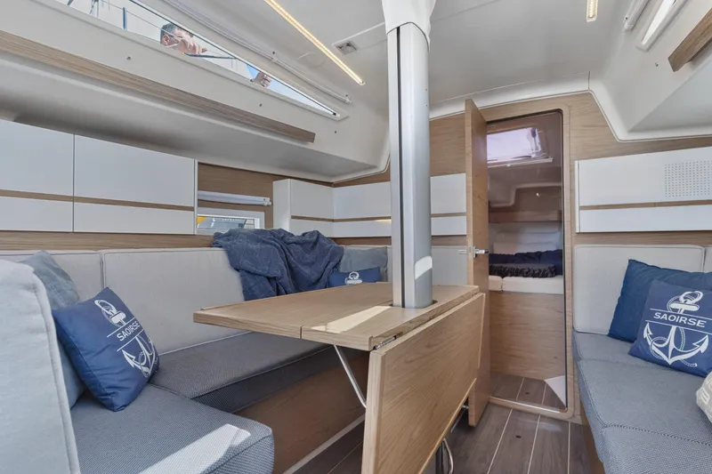 Slide: The Image of Modern interior of 2017 Elan E4 sailboat with cozy seating and wooden accents. - 21