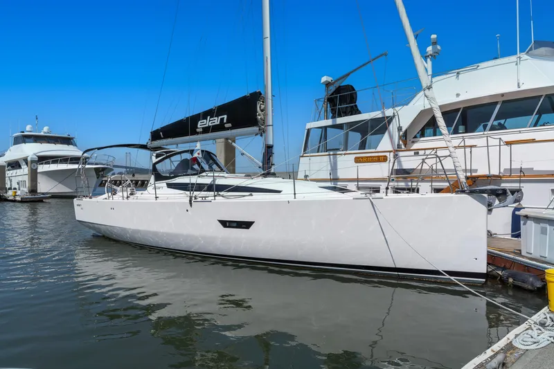 Slide: The Image of 2017 Elan E4 sailboat docked at marina under clear blue sky. - 25