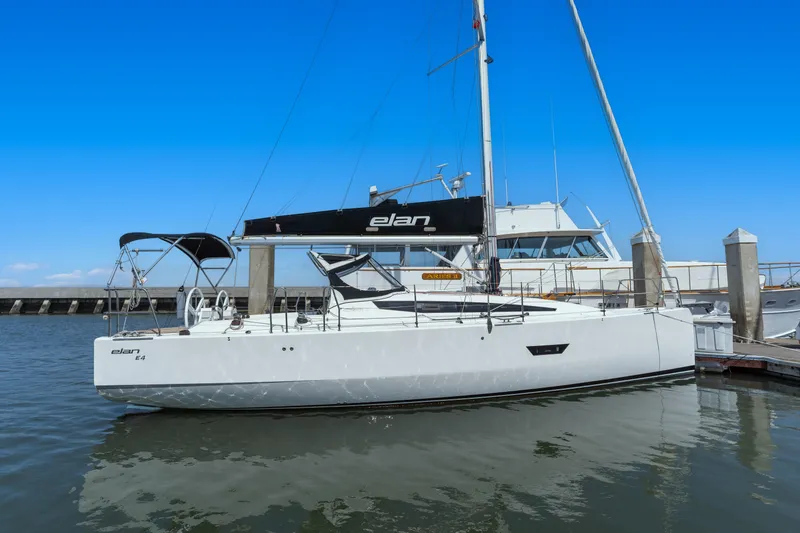 Slide: The Image of 2017 Elan E4 sailboat docked at marina under clear blue sky. - 28