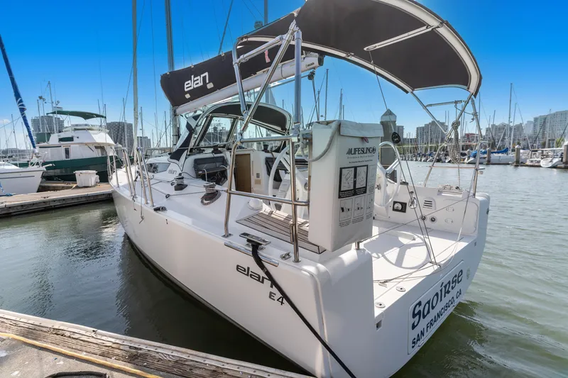 Slide: The Image of 2017 Elan E4 sailboat docked at marina, featuring sleek design and modern amenities. - 3