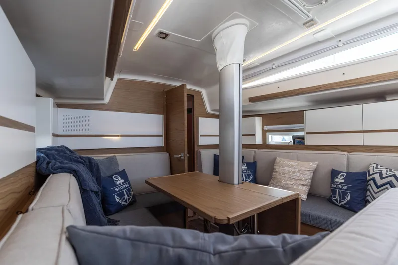 Slide: The Image of Modern interior of 2017 Elan E4 yacht with cozy seating and nautical decor. - 33