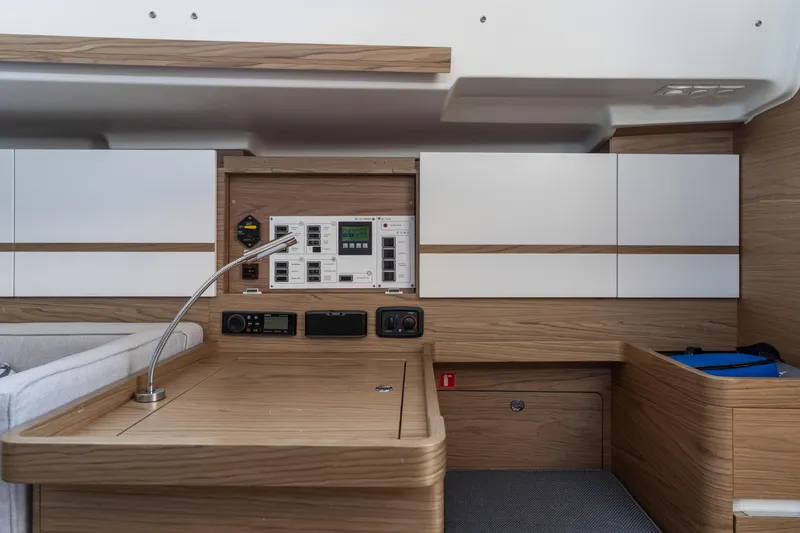 Slide: The Image of Modern interior of 2017 Elan E4 yacht with control panel and wooden cabinetry. - 34