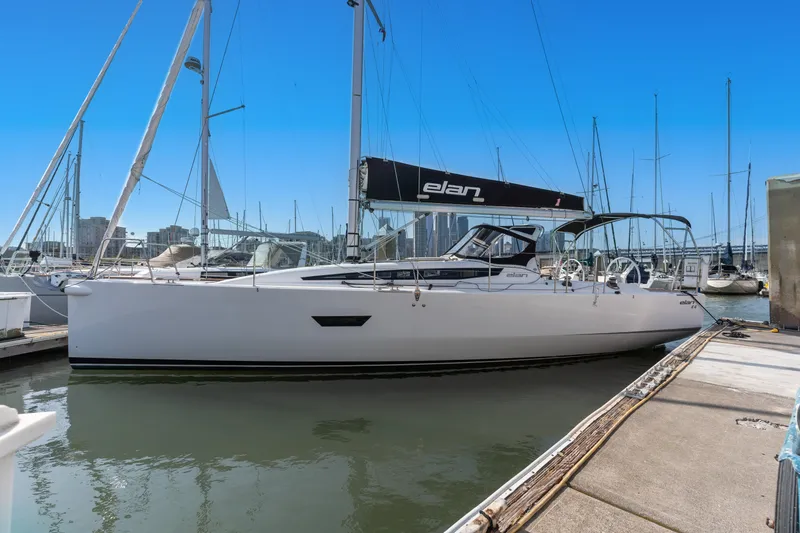 Slide: The Image of 2017 Elan E4 sailboat docked in marina under clear blue sky. - 35