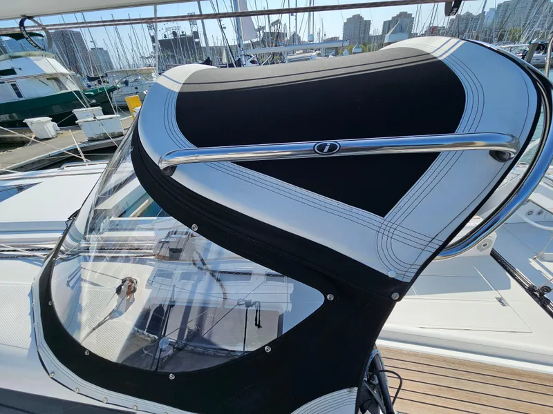 Slide: The Image of Sailboat cockpit cover on a 2017 Elan E4, docked at a marina. - 6
