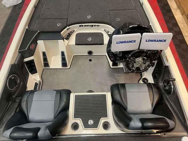 Slide: The Image of 2018 Ranger Z521C boat interior with dual Lowrance displays and comfortable seating. - 4