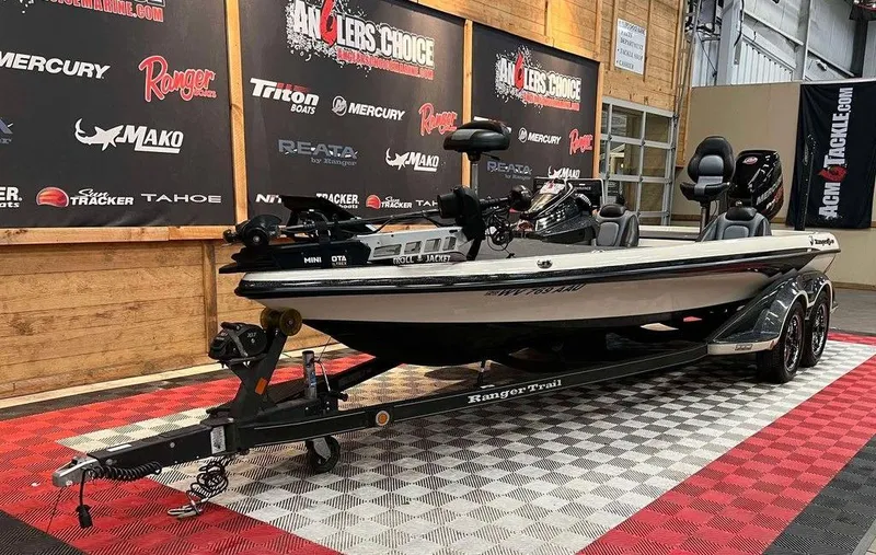 Slide: The Image of 2018 Ranger Z521C fishing boat on display in showroom with branded backdrop. - 5